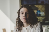 portrait photography of woman wearing knitted top